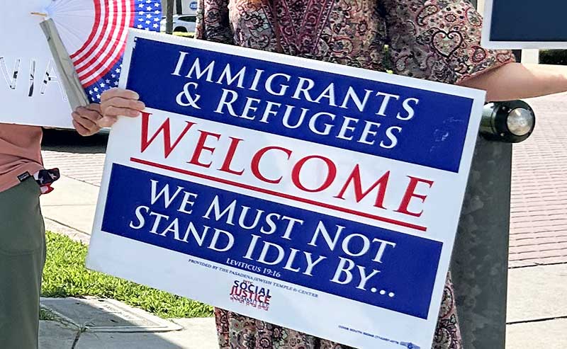 a sign in support of Immigration