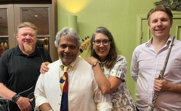 Four musicians with instruments