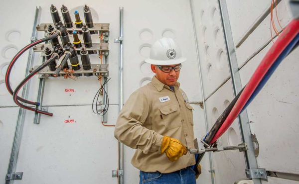 an electrician working on upgrading the grid