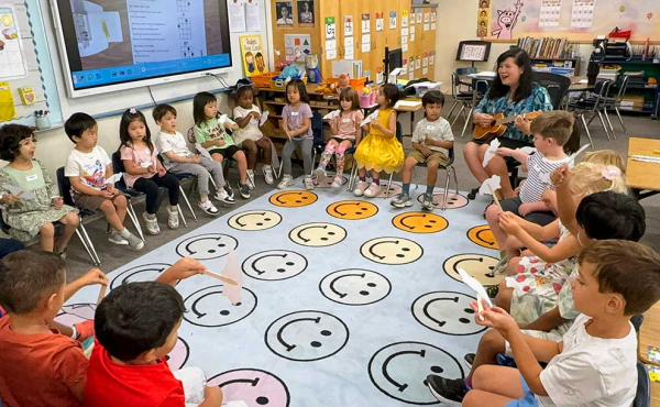 a teacher singing to students