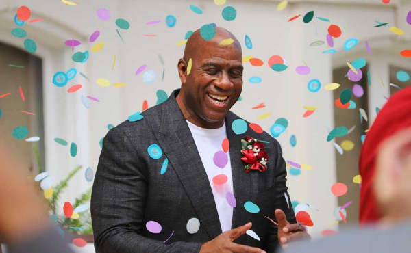 a man smiling with confetti