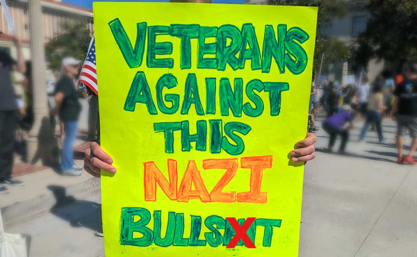 a sign that reads Veterans against Nazis