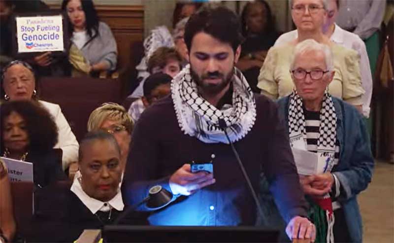 a man commenting at a meeting