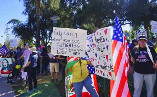 crowd holding signs