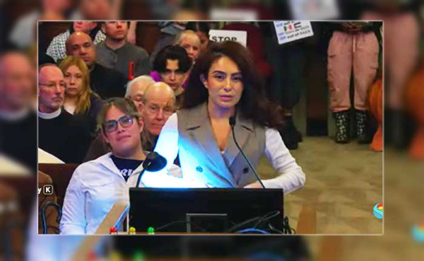 a woman speaking at the podium