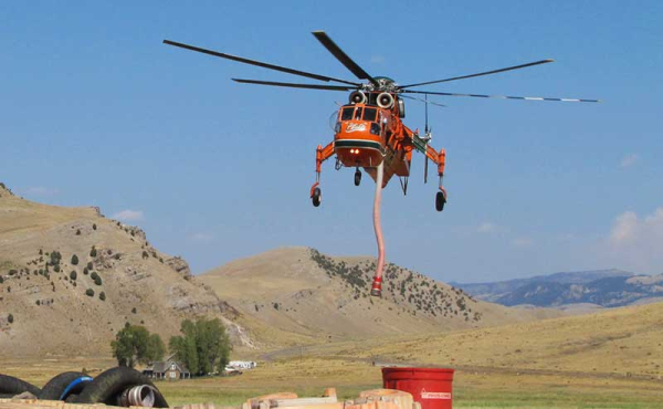 a helicopter fills up on water