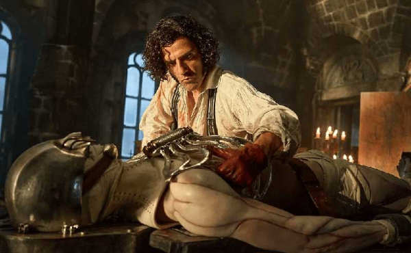 a man leaning over a monster