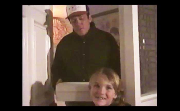 a scene from a home movie of a father and a son