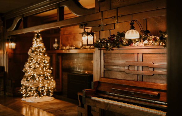 soft yellow glow of Christmas tree and wooden home interior