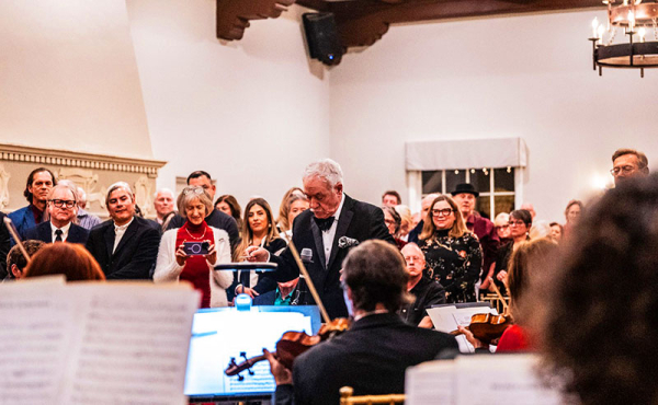 a man leading a concert