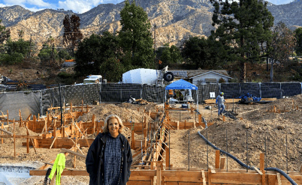 a woman standing in front of construction