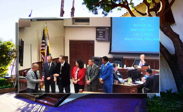 councilmembers standing honoring employees