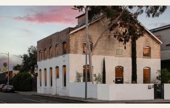 a two-toned industrial building in fading light