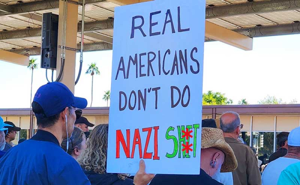 a man holding a sign