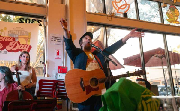 a man with his guitar singing