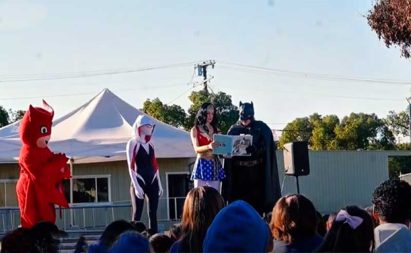 students and comic figures reading