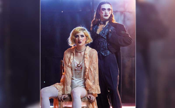 a man and a woman posing on stage