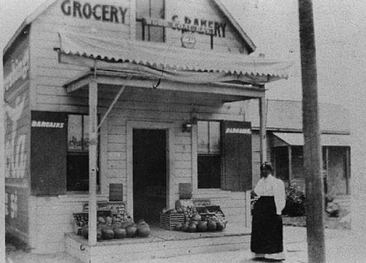 a woman standing in front of a building