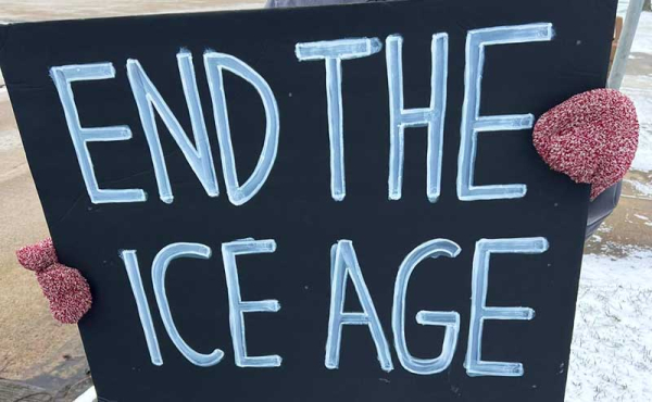 a sign that says L End the Ice Age