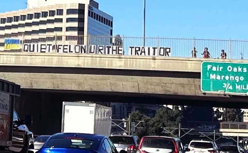 a sign at an overpass