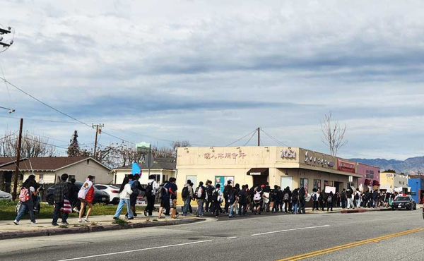 students walking on the sidewalk