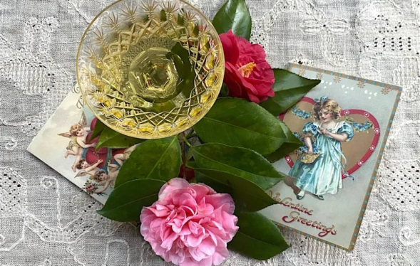 a table tableau of flowers and golden champagne glass