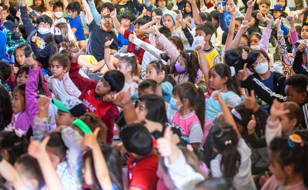 students giving thumbs up