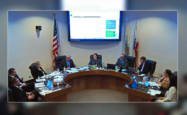 councilmembers meeting in a chamber