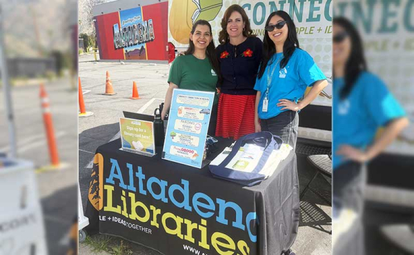 standing in front of a book van