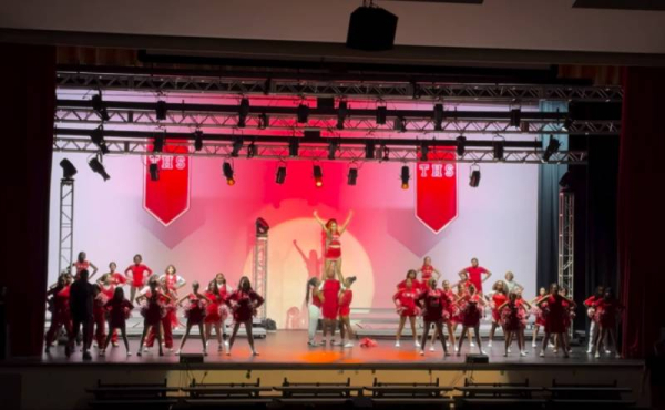 students performing on stage