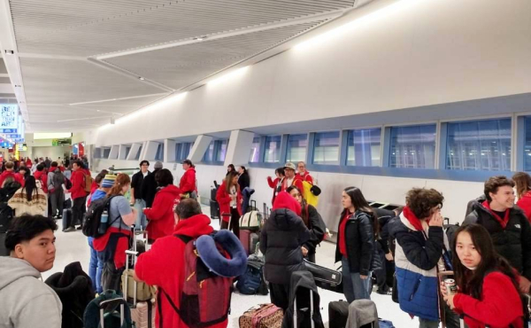 students at an airport