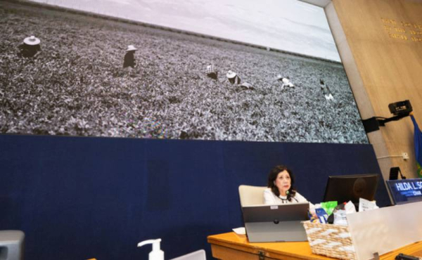 a woman behind a table